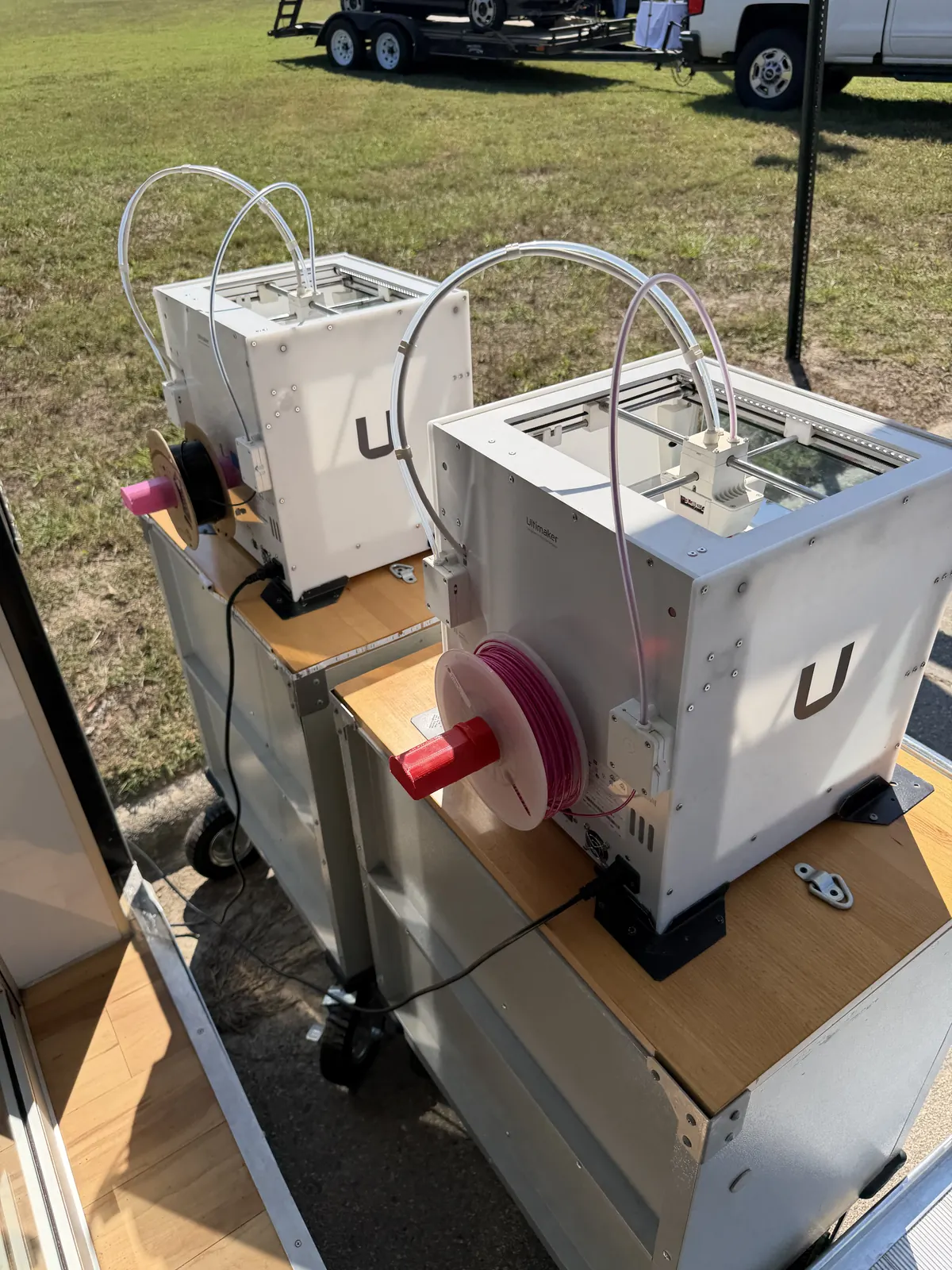 3D printers ready beside the mobile lab.