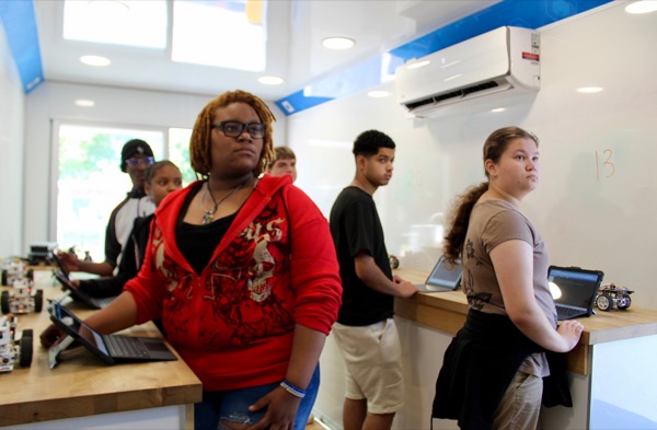 Students building circuits inside a Betabox mobile lab.